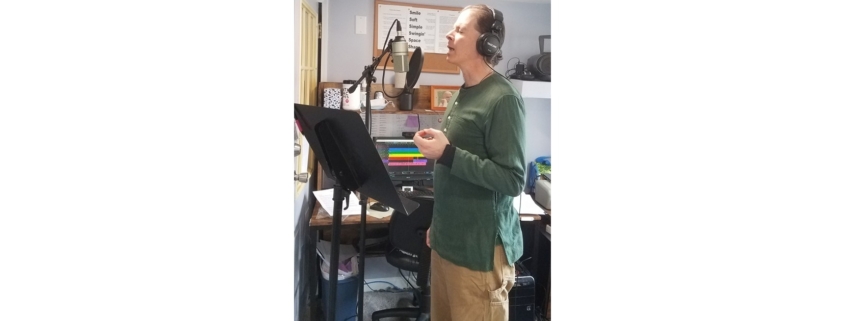 Dennis singing into mic recording custom song