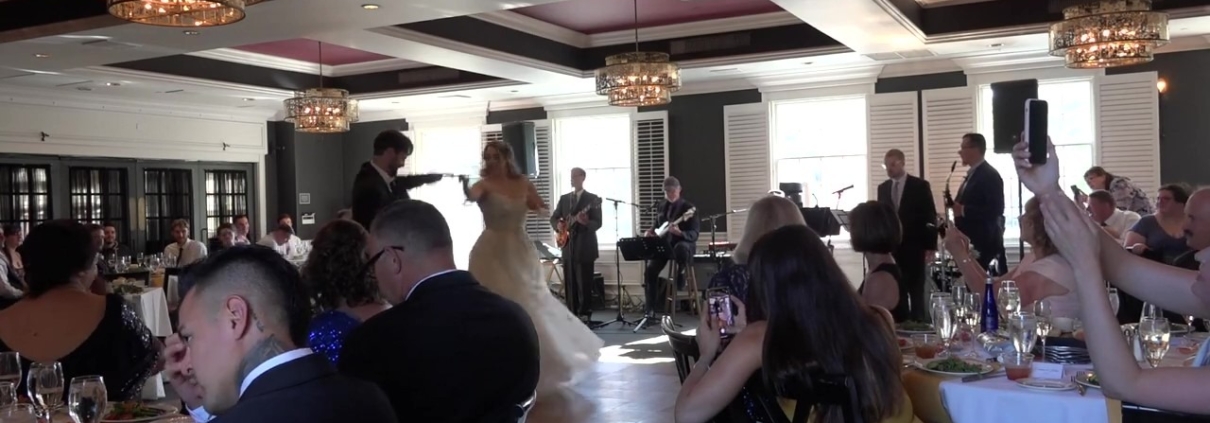 couple doing first dance to The Way Band at reception