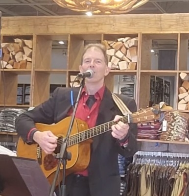 Dennis Winge playing country music at Boot Barn in Rochester