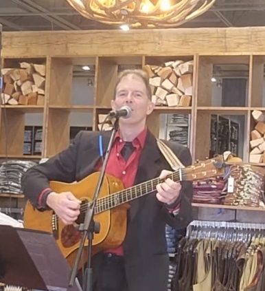 Dennis Winge playing country music at Boot Barn in Rochester