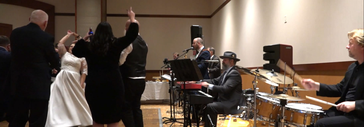 bride twirling to "Dancing Queen" played live by The Way Band