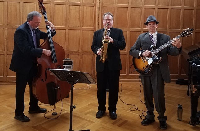 jazz trio in roaring 20s attire playing a Cornell event