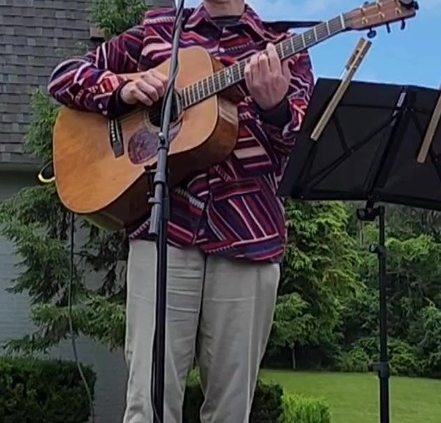 Dennis singing and playing guitar at Bethany Retirement Home