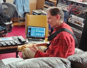 Dennis recording midi parts using midi guitar in pro studio