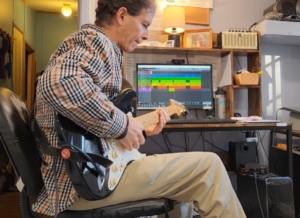 Dennis recording pro tracks for client in studio