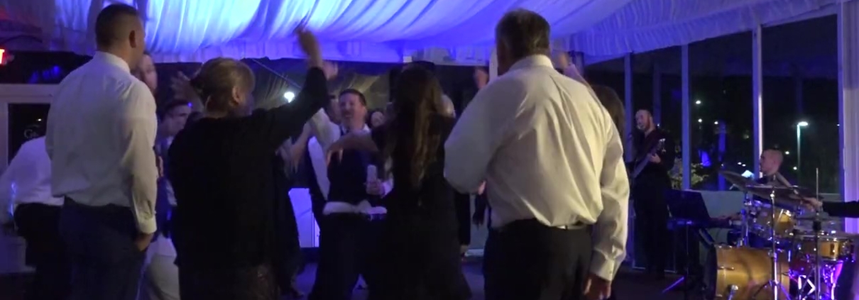 groom and guests dancing at Hope Lake Lodge wedding