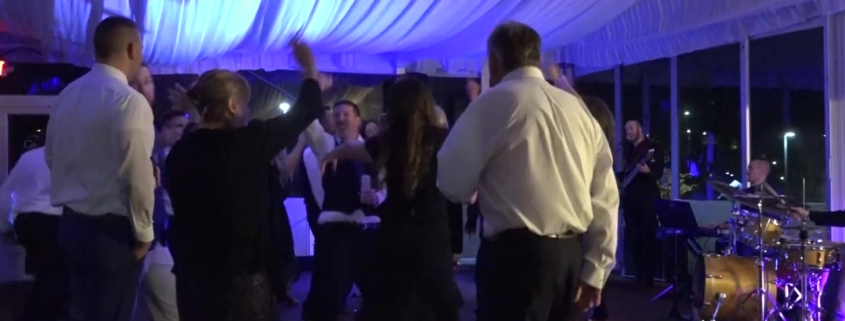 groom and guests dancing at Hope Lake Lodge wedding