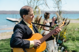 Wedding guitarist Dennis Winge playing at a reception.