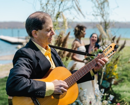 guitarist near wedding couple during ceremony