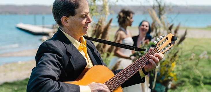 guitarist near wedding couple during ceremony