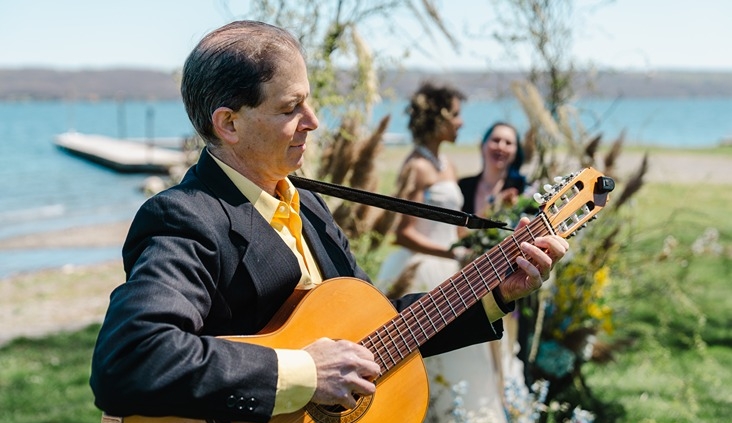 guitarist near wedding couple during ceremony