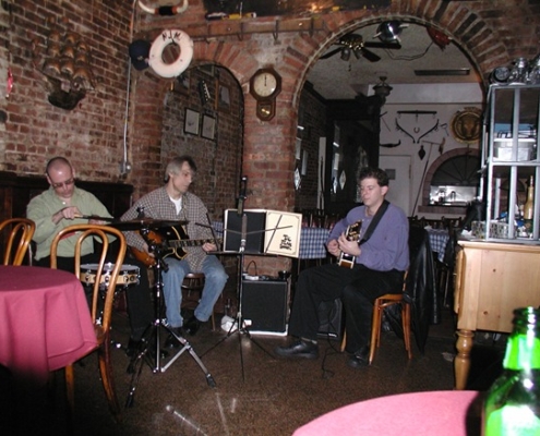 Ron Parmentier and Dennis Winge and Cole playing at restaurant