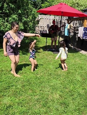 kids dancing at family party to live music