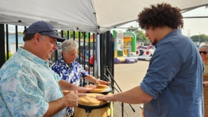 Salsa Libre band members around congas