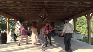 dennis jamming with guests at country wedding