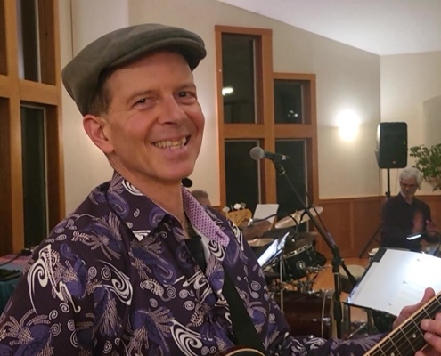 Dennis smiling at Joy of Latin Jazz interactive concert
