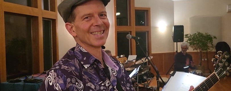 Dennis smiling at Joy of Latin Jazz interactive concert
