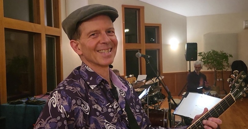 Dennis smiling at Joy of Latin Jazz interactive concert
