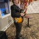 Dennis Winge playing guitar at 1244 Tavern