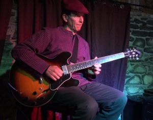 Dennis Winge performing at Art of Solo Guitar concert at Downstairs in Ithaca NY