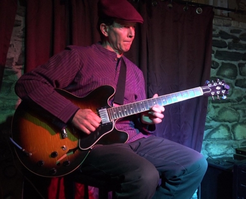 Dennis Winge performing at Art of Solo Guitar concert at Downstairs in Ithaca NY