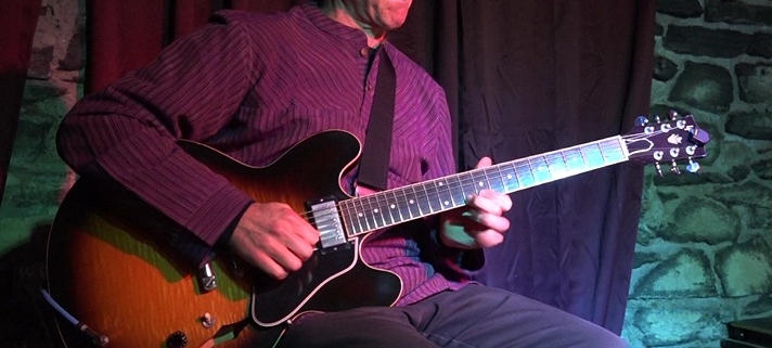Dennis Winge performing at Art of Solo Guitar concert at Downstairs in Ithaca NY