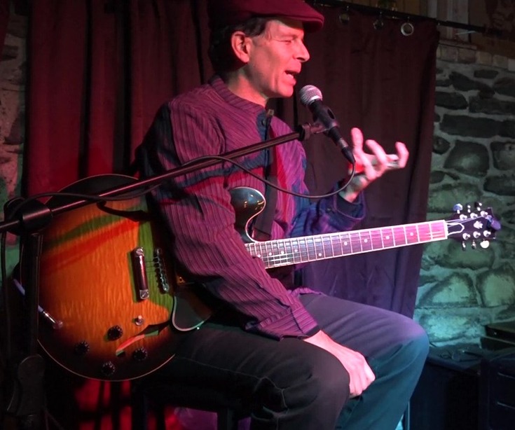 Dennis Winge lecturing and demonstrating at Art of Solo Guitar concert at Downstairs in Ithaca NY