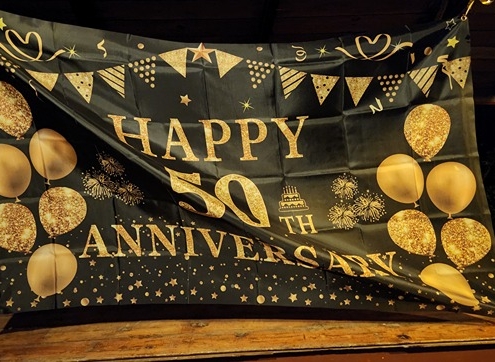sign at 50th anniversary party with Blue Train blues band
