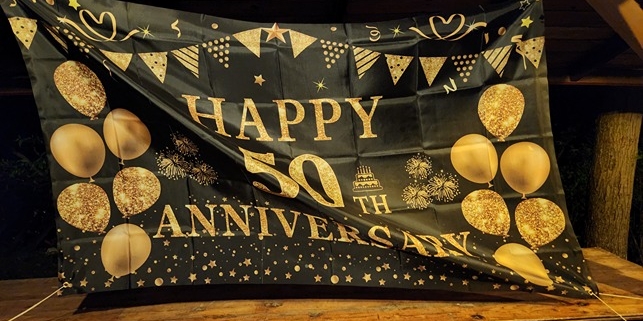 sign at 50th anniversary party with Blue Train blues band