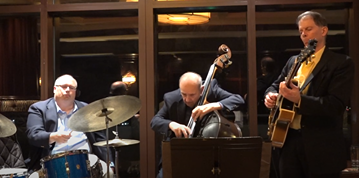 Dennis Winge playing live music for corporate events with his band.