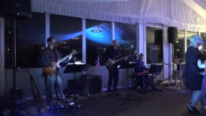 Wedding band performing at tented reception in Myrtle Beach
