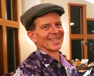 Dennis smiling at a performance