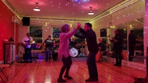 couple dancing to sunset salsa