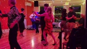 people dancing to sunset salsa band