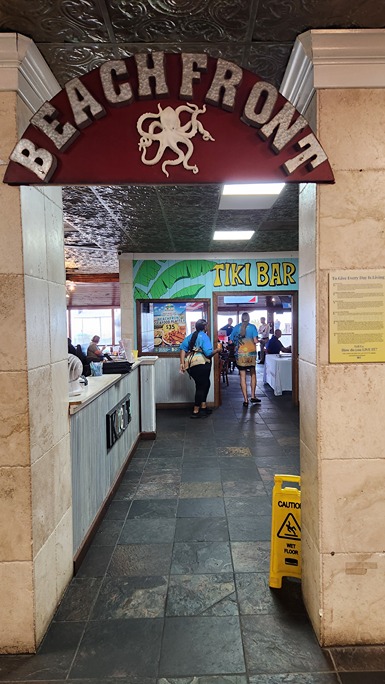 entrance to tiki bar at beachfront kitchen & bar