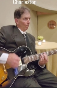 Dennis playing jazz guitar at American Theatre